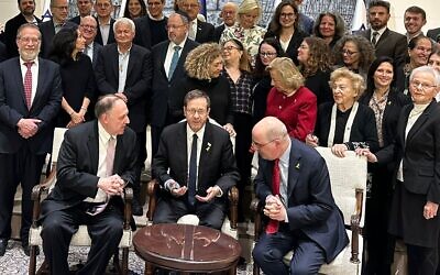 A Claims Conference meeting in Jerusalem, February 11, 2025. Seated right to left: Claims Conference President Gideon Taylor, Israeli President Isaac Herzog, and Claims Conference CEO Greg Schneider (Courtesy/Claims Conference)