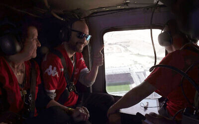 Released hostage Iair Horn (left) flies above Turner Stadium in Beersheba in an IAF helicopter, February 15, 2025. (Israel Defense Forces)