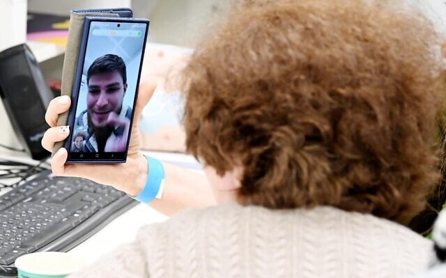 Sasha Troufanov speaks with his grandmother Irina in a video call soon after his release from Hamas captivity, February 15, 2025. (GPO / Avi Ohayon)