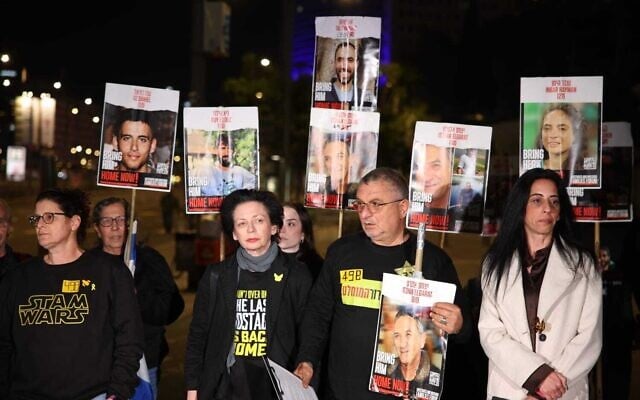 Einav Zangauker, mother of hostage Matan Zangauker, right, and Danny Elgarat, brother of hostage Itzik Elgarat, second from right, at a protest for all hostages' release on Begin Road in Tel Aviv on February 15, 2025. (Yoram Shpirer/Pro-Democracy Protest Movement)