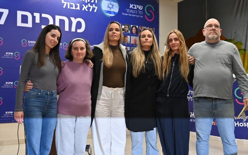 The families of Sasha Troufanov and Sagui Dekel-Chen speak to the press on February 16, 2025, a day after their loved ones were released from 498 days of captivity in Gaza. (Hostages Families Forum)
