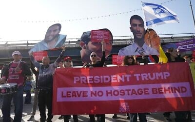 Protesters urging the release of hostages block Namir Road in Tel Aviv on the 500th day of the war sparked by Hamas's October 7, 2023 invasion and massacre, with signs that read, 'President Trump, leave no hostage behind - 500 days in hell,' February 17, 2025. (Dana Reany/Israeli Pro-Democracy Protest Movement)