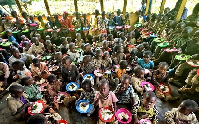 In this undated photo, malnourished children eat nutritious meals at the Africa 3030 compound in the eastern Democratic Republic of Congo. (Courtesy) In this undated photo, malnourished children eat nutritious meals at the Africa 3030 compound in the eastern Democratic Republic of Congo. (Courtesy)