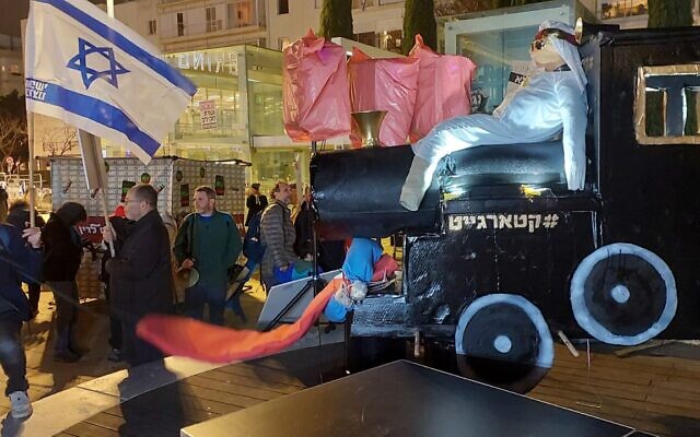 A "Qatargate" exhibit criticizing Prime Minister Benjamin Netanyahu over his aides' alleged ties to Qatar, at an anti-government protest at Habima Square in Tel Aviv, February 22, 2025. (Efrat Safran/Pro-Democracy Protest Movement)
