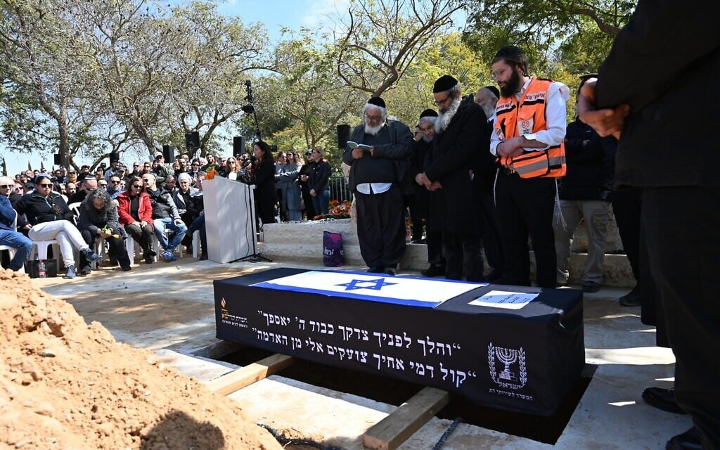 The coffin of Shiri Bibas and sons Ariel and Kfir during the slain hostages' funeral near Kibbutz Nir Oz, February 26, 2025. (Eitan Uner/Hostages and Missing Families Forum)