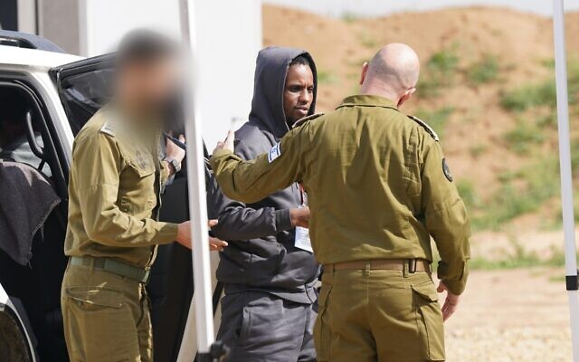 Released hostage Avera Mengistu, who spent 3,821 days in Hamas captivity, is handed over to IDF troops in the Gaza Strip on February 22, 2025 (Israel Defense Forces)