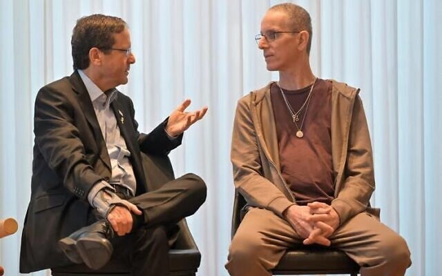 President Isaac Herzog, left, meets released hostage Ohad Ben Ami in Jerusalem, February 17, 2025. (Kobi Gideon/GPO)