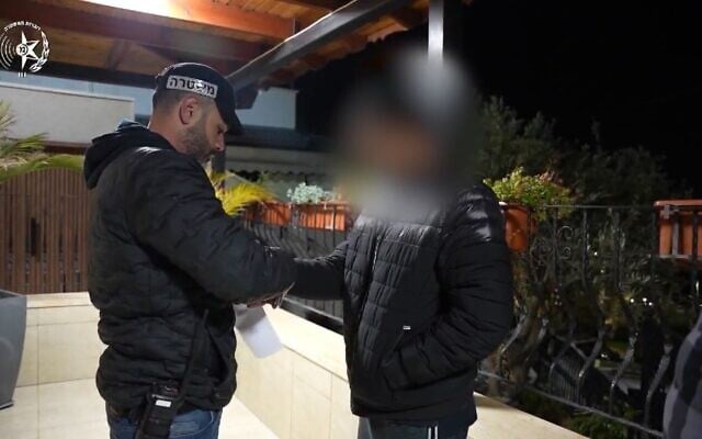 Police arrest a suspect in a raid on the Abu Latif crime ring on February 26, 2025. (Israel Police)