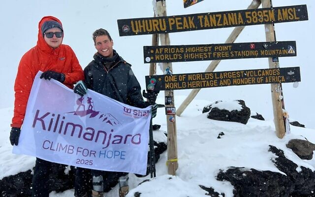 Maayan Gabai, right, and Dr. Pieter Jan Van-Balen reach the summit of Mt. Kilimanjaro on January 28, 2025. (Courtesy)
