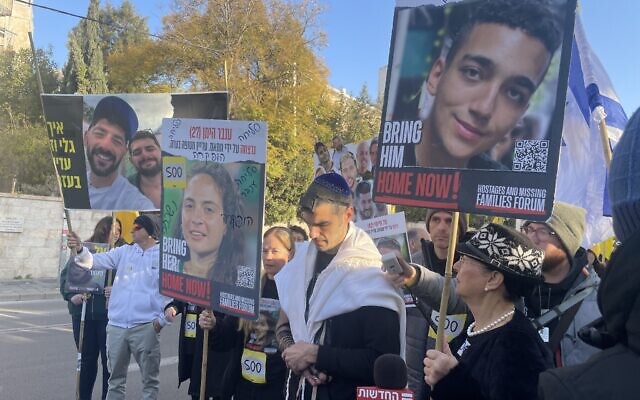 Levi Ben Baruch, uncle of hostage Edan Alexander, center, at an event marking 500 days since Hamas's October 7, 2023, onslaught, on Azza Street in Jerusalem, February 17, 2025. (Jessica Steinberg/Times of Israel)