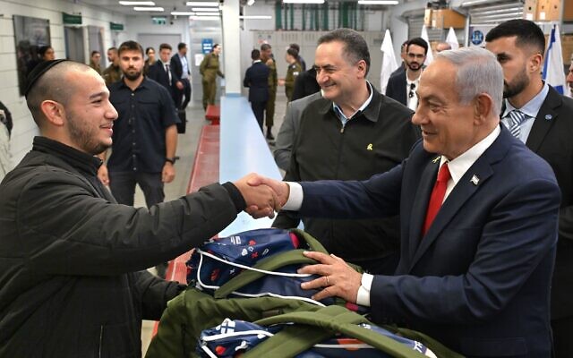 Prime Minister Benjamin Netanyahu and Defense Minister Israel Katz visit the IDF induction center, on March 23, 2025. (Haim Zach/GPO) Prime Minister Benjamin Netanyahu and Defense Minister Israel Katz visit the IDF induction center, on March 23, 2025. (Haim Zach/GPO)