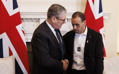 British Prime Minister Keir Starmer (left) hosts recently released hostage Eli Sharabi at 10 Downing Street, March 7, 2025. (Simon Dawson / No 10 Downing Street)