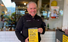 Waze co-founder Uri Levine presenting the the new edition of his book 'Fall in Love with the Problem, Not the Solution - A Handbook for Entrepreneurs.' (Shoshanna Solomon/Times of Israel)