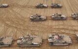 Armored vehicles of the 36th Division are seen at a staging ground in southern Israel, in a handout photo issued by the military on March 23, 2025. (Israel Defense Forces)