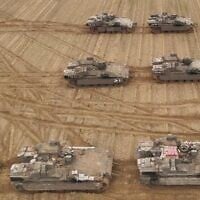 Armored vehicles of the 36th Division are seen at a staging ground in southern Israel, in a handout photo issued by the military on March 23, 2025. (Israel Defense Forces)