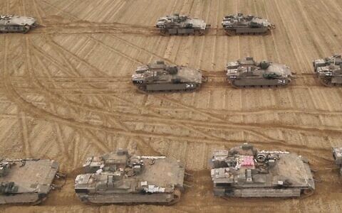 Armored vehicles of the 36th Division are seen at a staging ground in southern Israel, in a handout photo issued by the military on March 23, 2025. (Israel Defense Forces)