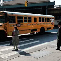 A yeshiva school bus drives through Borough Park on September 12, 2022 in the Brooklyn borough of New York City (Spencer Platt / Getty Images North America / Getty Images via AFP)