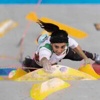 Iranian climber Elnaz Rekabi competing during the women boulder finals of the Asian Championships of the IFSC in Seoul, South Korea. (Photo by Rhea KANG / INTERNATIONAL FEDERATION OF SPORT CLIMBING / AFP)