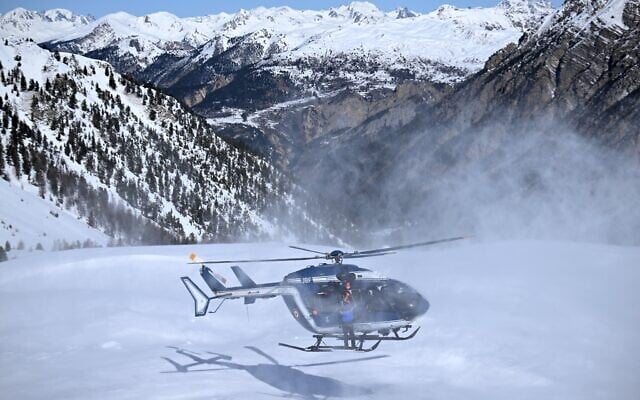 Illustrative: An helicopter of the French 'Peloton de Gendarmerie de Haute Montagne' (High Mountain Police Squad, PGHM) lands during an avalanche search and rescue training, near Briancon in the French Alps on March 16, 2023. (Nicolas TUCAT / AFP) Illustrative: An helicopter of the French 'Peloton de Gendarmerie de Haute Montagne' (High Mountain Police Squad, PGHM) lands during an avalanche search and rescue training, near Briancon in the French Alps on March 16, 2023. (Nicolas TUCAT / AFP)