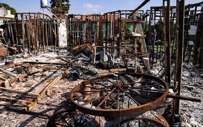Charred objects are scattered on the ground, in Moshav Netiv Ha'asara in southern Israel near the border with the Gaza Strip  on November 17, 2023, in the aftermath of Hamas's October 7 terror onslaught. (RONALDO SCHEMIDT / AFP)