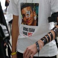 Roy Alexander, the brother of Hamas hostage Edan Alexander, puts on tefillin at Ohel Chabad Lubavitch on October 7, 2024, in New York City. (Michael M. Santiago/Getty Images/AFP)