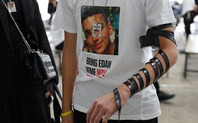 Roy Alexander, the brother of Hamas hostage Edan Alexander, puts on tefillin at Ohel Chabad Lubavitch on October 7, 2024, in New York City. (Michael M. Santiago/Getty Images/AFP) Roy Alexander, the brother of Hamas hostage Edan Alexander, puts on tefillin at Ohel Chabad Lubavitch on October 7, 2024, in New York City. (Michael M. Santiago/Getty Images/AFP)