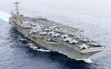 In this handout image provided by the US NAVY the Nimitz-class aircraft carrier USS Harry S. Truman (CVN 75) transits the Strait of Gibraltar, November 25, 2024. (Michael Gomez / US NAVY / AFP)