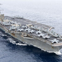 In this handout image provided by the US NAVY the Nimitz-class aircraft carrier USS Harry S. Truman (CVN 75) transits the Strait of Gibraltar, November 25, 2024. (Michael Gomez / US NAVY / AFP)