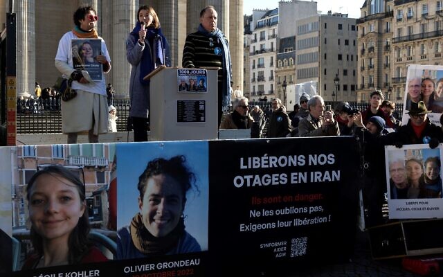 Relatives rally in Paris in support of French nationals being held by Iran Cecile Kohler, Jacques Paris and Olivier Grondeau on February 1, 2025. (Sébastien DUPUY / AFP)