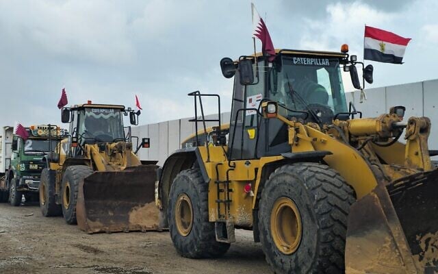 Heavy construction equipment lines up on the Egyptian side of the Rafah border crossing with the Gaza Strip on February 20, 2025. (AFP) Heavy construction equipment lines up on the Egyptian side of the Rafah border crossing with the Gaza Strip on February 20, 2025. (AFP)
