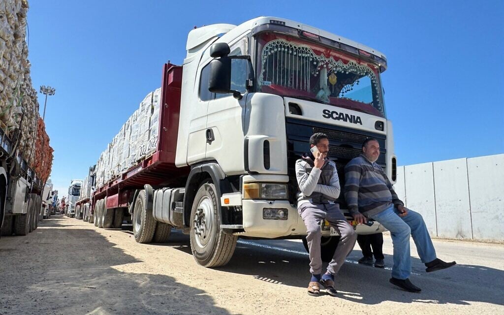 Trucks carrying humanitarian aid line up on the Egyptian side of the Rafah border crossing with the Gaza Strip on March 2, 2025. (AFP)