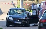 Forensic officers examine a damaged vehicle at the site of a car-ramming attack in Mannheim, southwestern Germany, March 3, 2025. (Thomas Lohnes / AFP)