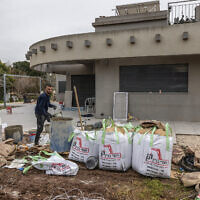 Builders renovate a house in Israel's northern kibbutz of Hanita near the border with Lebanon on March 3, 2025 (Menahem KAHANA / AFP)