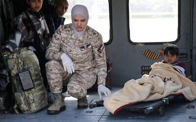 This handout picture released on March 4, 2025, by the Jordanian army shows a child who has been evacuated from the Gaza Strip arriving in a Jordanian army helicopter at a hospital compound in Amman. (Jordanian Royal Palace/AFP)