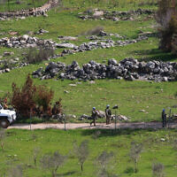 UNIFIL peacekeeping troops patrol the southern Lebanese village of Ramia near the southern border on March 5, 2025. (Mahmoud ZAYYAT / AFP)