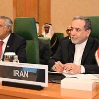 Iran's Foreign Minister Abbas Araghchi (R) and Pakistan's Foreign Minister Ishaq Dar attend an Extraordinary Session of the Council of Foreign Ministers of the Member States of The Organisation of Islamic Cooperation (OIC) in Jeddah on March 7, 2025 (Amer HILABI / AFP)