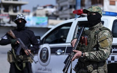 This handout picture released by the official Syrian Arab News Agency (SANA) on March 8, 2025, shows Syrian forces manning a checkpoint in the coastal city of Latakia. (SANA/AFP)