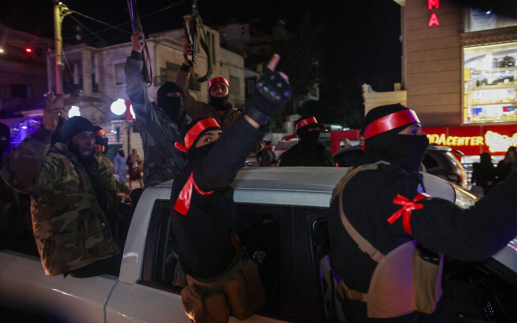 Members of Syria's new security forces depart from the northwestern city of Idlib as reinforcement for the coastal area on March 8, 2025.amid widespread violence and reports of executions in the Alawite heartland on the country's Mediterranean coast (Photo by Omar HAJ KADOUR / AFP)