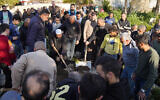 Syrian attend the funeral of a relative, killed in the days of clashes between security forces and loyalists of the former government, in the town of Jableh in the coastal province of Latakia on March 10, 2025. (Photo by Abdulwajed HAJ ESTEIFI / AFP)