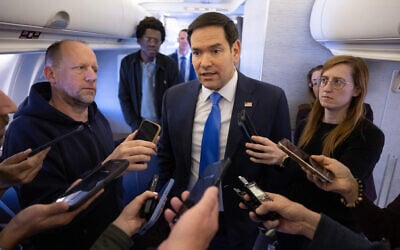 US Secretary of State Marco Rubio speaks with the media on a military airplane as he flies to Jeddah, Saudi Arabia, March 10, 2025. (SAUL LOEB / POOL / AFP)