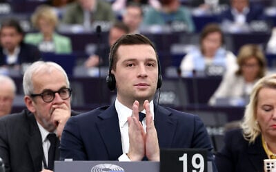French far-right party Rassemblement National (RN) President and MEP Jordan Bardella listens to speeches as part of the celebrations for International Women's Rights Day, during a plenary session of the European Parliament on March 11, 2025 in Strasbourg, eastern France. (Frederick Florin / AFP)