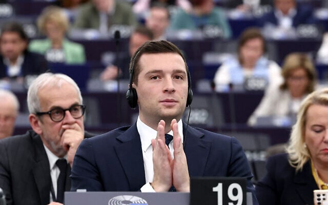 French far-right party Rassemblement National (RN) President and MEP Jordan Bardella listens to speeches as part of the celebrations for International Women's Rights Day, during a plenary session of the European Parliament on March 11, 2025 in Strasbourg, eastern France. (Frederick Florin / AFP) French far-right party Rassemblement National (RN) President and MEP Jordan Bardella listens to speeches as part of the celebrations for International Women's Rights Day, during a plenary session of the European Parliament on March 11, 2025 in Strasbourg, eastern France. (Frederick Florin / AFP)