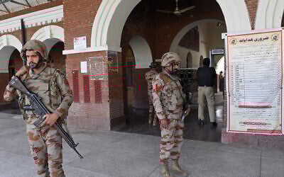 Paramilitary soldiers stand guard at a railway station in the Sibi district of southwestern Balochistan province on March 12, 2025, during a security operation against militants a day after they hijacked a passenger train. (Banaras KHAN / AFP)