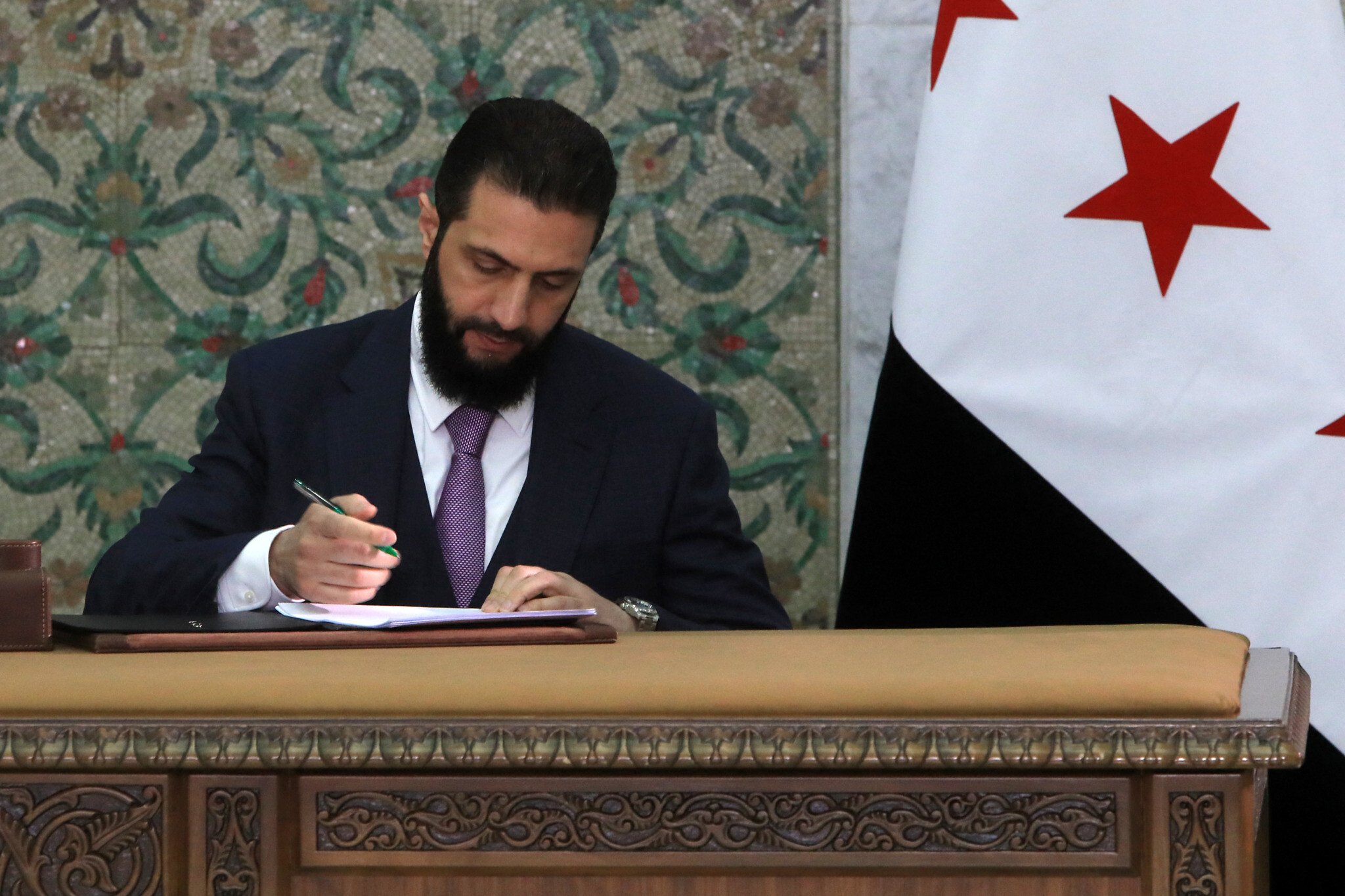 NextImg:Syria’s interim president signs constitution enshrining Islamist rule for 5 years