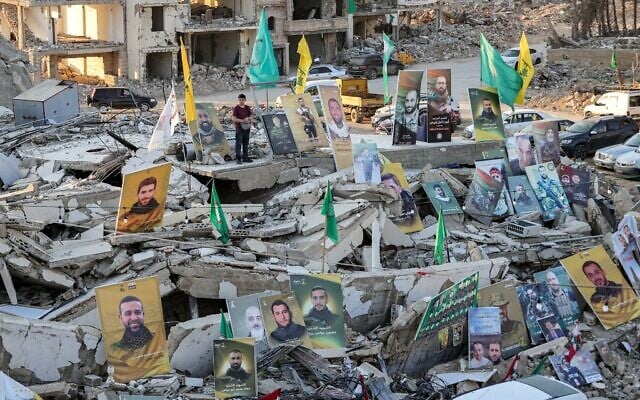 Pictures of Hassan Nasrallah, the slain former leader of Lebanese Shiite terror group Hezbollah, and other killed fighters displayed amid the rubble of destroyed buildings in Lebanon's southern village of Khiam, near Israel's border on March 15, 2025. (Rabih Daher / AFP) Pictures of Hassan Nasrallah, the slain former leader of Lebanese Shiite terror group Hezbollah, and other killed fighters displayed amid the rubble of destroyed buildings in Lebanon's southern village of Khiam, near Israel's border on March 15, 2025. (Rabih Daher / AFP)