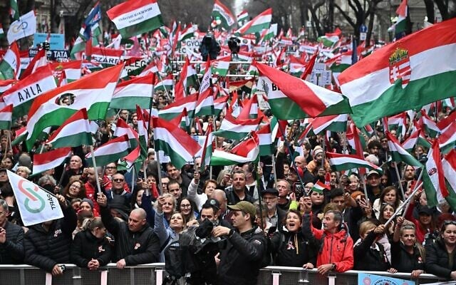 People wave flags as they attend a demonstration ahead a speech of chairman of the Tisza (Respect and Freedom) party Peter Magyar in Budapest on March 15, 2025, on National Day that marks the Hungarian revolution against the Austrian Empire in 1848. (Attila Kisbenedek/AFP) People wave flags as they attend a demonstration ahead a speech of chairman of the Tisza (Respect and Freedom) party Peter Magyar in Budapest on March 15, 2025, on National Day that marks the Hungarian revolution against the Austrian Empire in 1848. (Attila Kisbenedek/AFP)