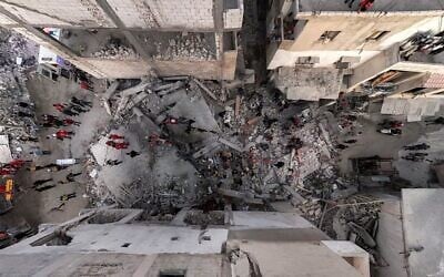 Syrian Civil Defense and first responders inspect the site of an explosion in Syria's western coastal city of Latakia, March 15, 2025. (SANA / AFP)