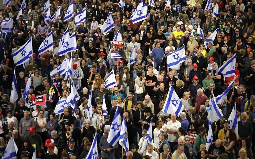 Demonstrator call for the return of Israeli hostages held captive by Hamas terrorists in the Gaza Strip, in front of the Defense Ministry in Tel Aviv on March 15, 2025. (Jack Guez/AFP)