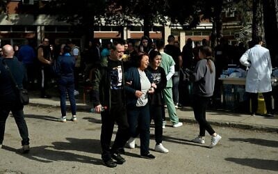 Friends and relatives of the victims gather in front of a hospital following a fire in a nightclub which killed 51 people in Kocani, a town some 100 kilometres east of the capital Skopje, on March 16, 2025. (Robert Atanasovski / AFP)