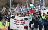 People hold signs as they protest the arrest of former Columbia University anti-Israel student activist Mahmoud Khalil during a 'Fight for Our Rights' demonstration at the University of Washington campus in Seattle, Washington, March 15, 2025. (Jason Redmond / AFP)